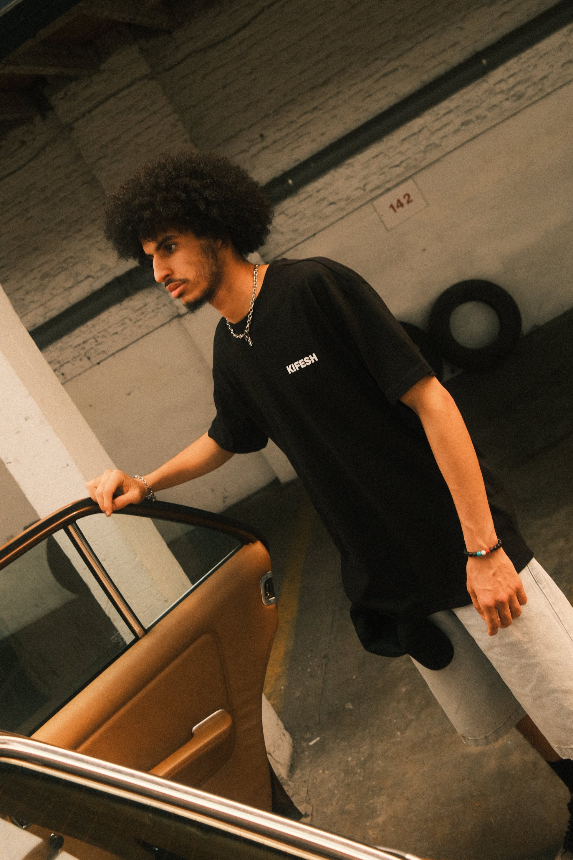 kifesh clothing chair tee front on model